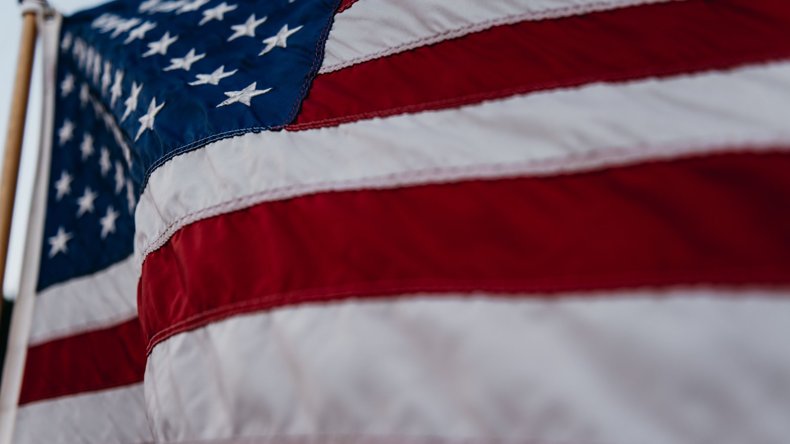 A close view of an American flag moving in the wind, not a photograph of this event.