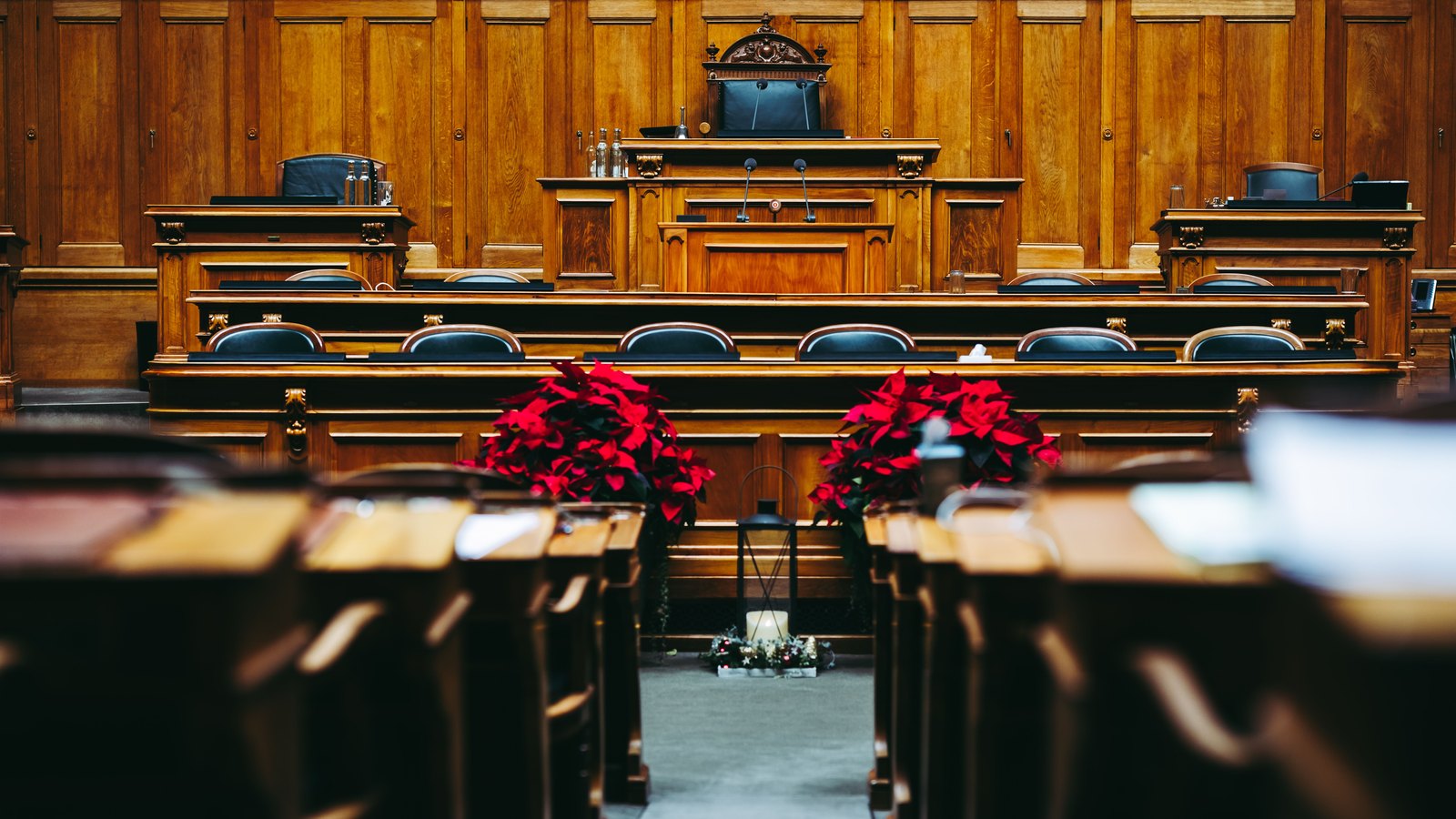 An empty wood paneled courtroom, not a photograph of this case.