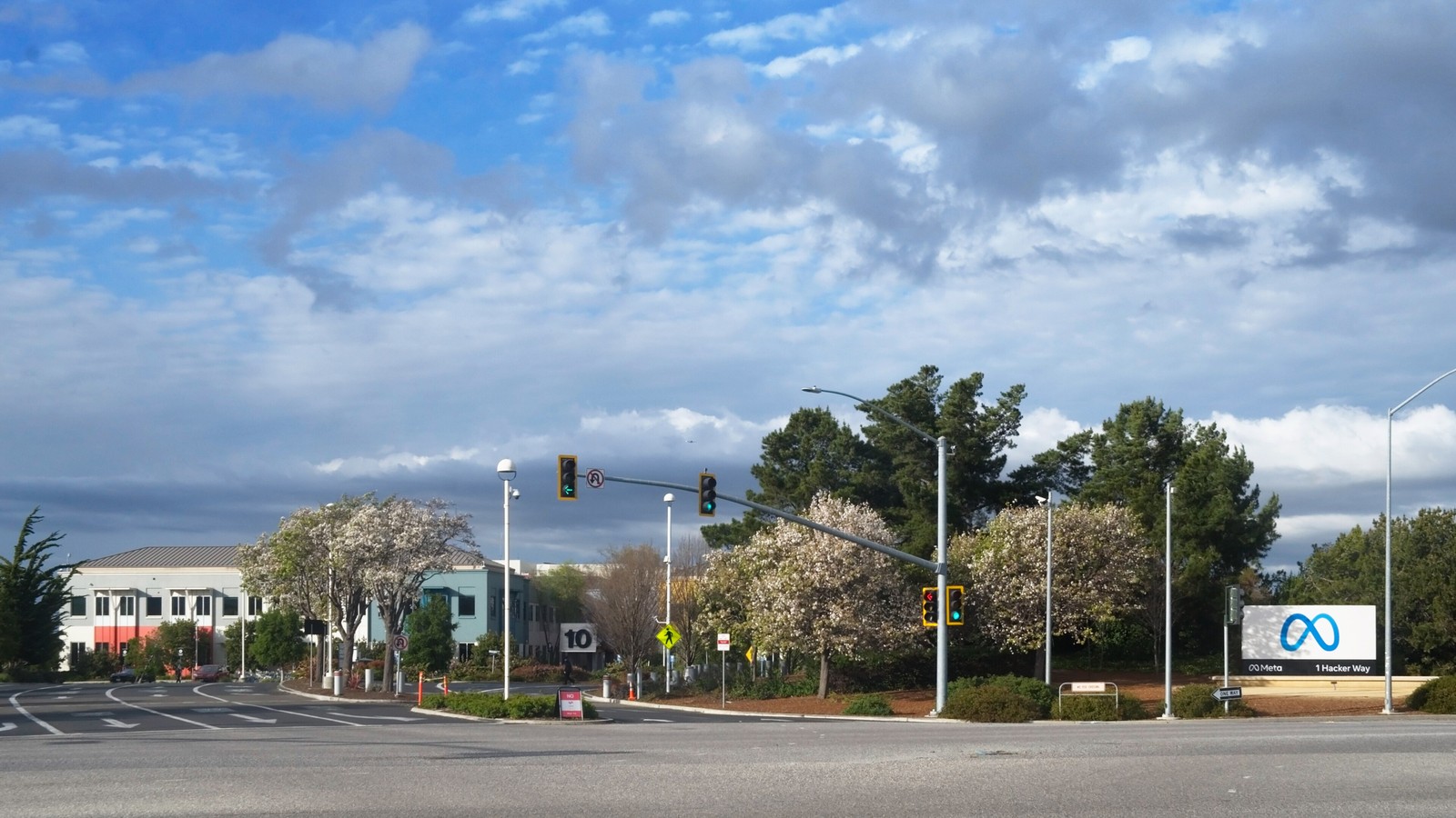 The entrance to Meta headquarters in Menlo Park, with the Meta sign beside the road, photographed in March 2022.