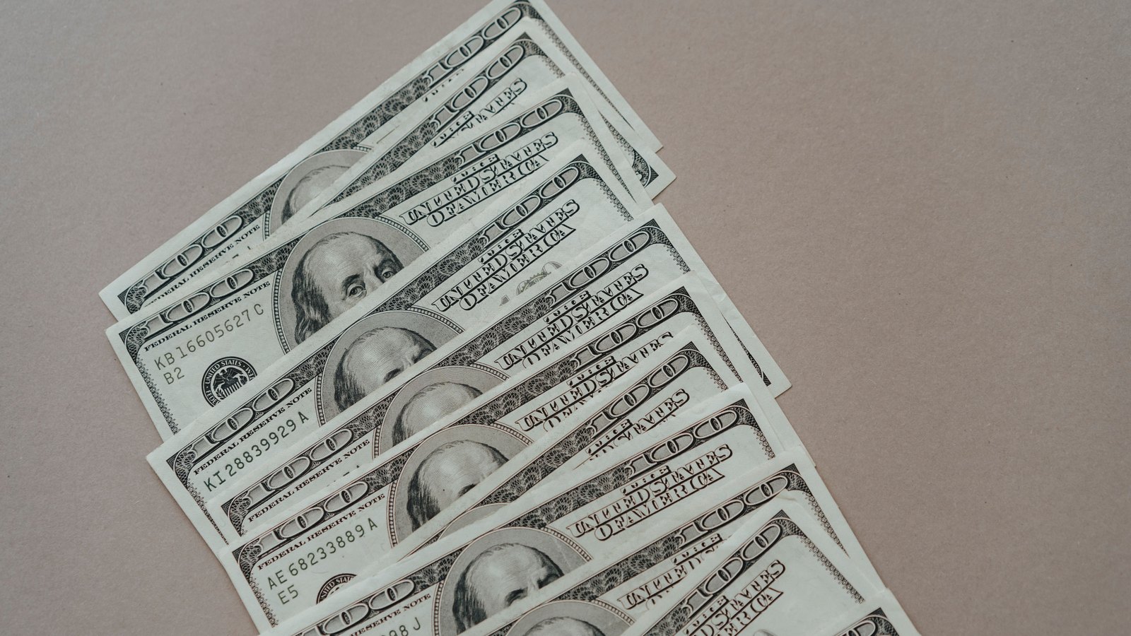 A photograph illustrating dollar bills stack.