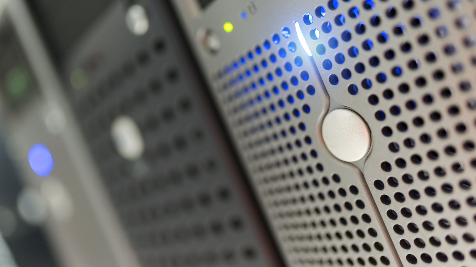 A photograph illustrating server rack indicator lights macro.