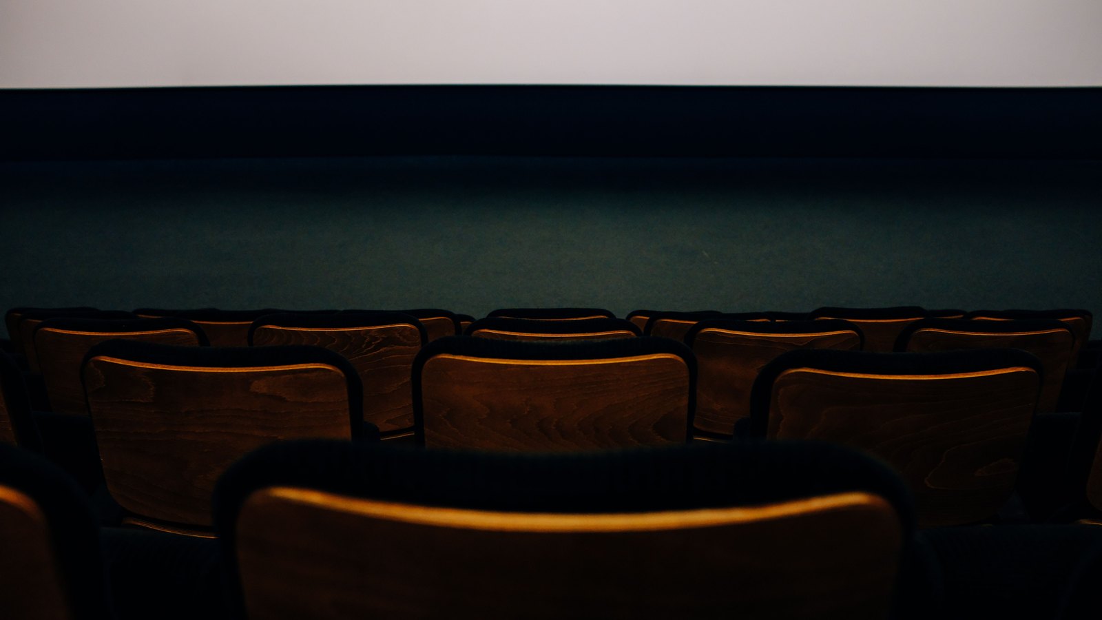 A photograph illustrating empty cinema seats.