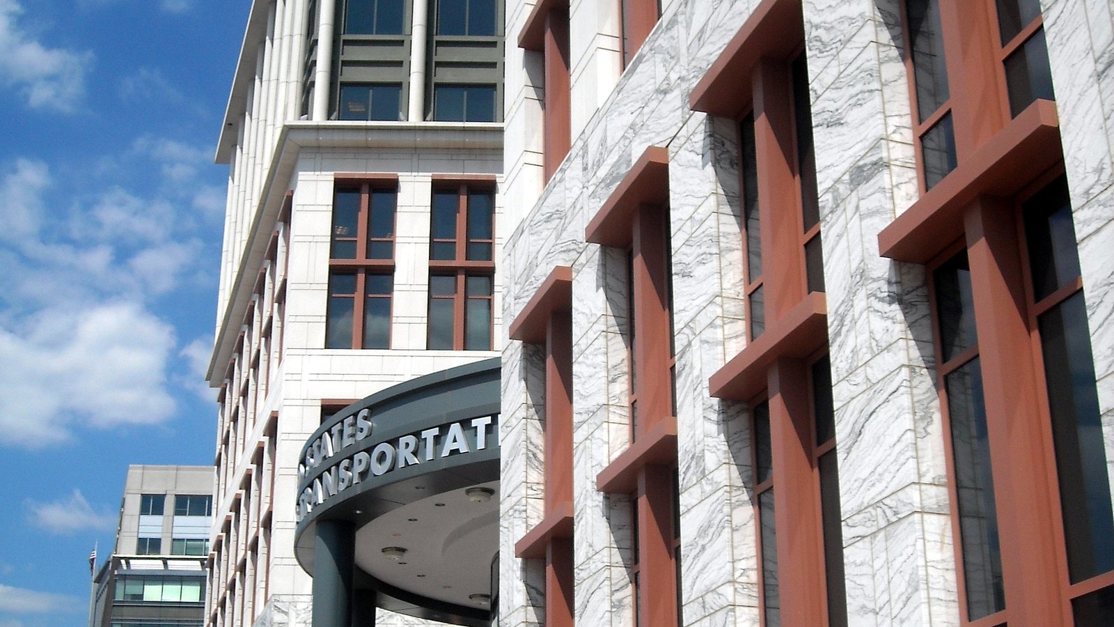 The marble and red stone west entrance of the US Department of Transportation headquarters in Washington.
