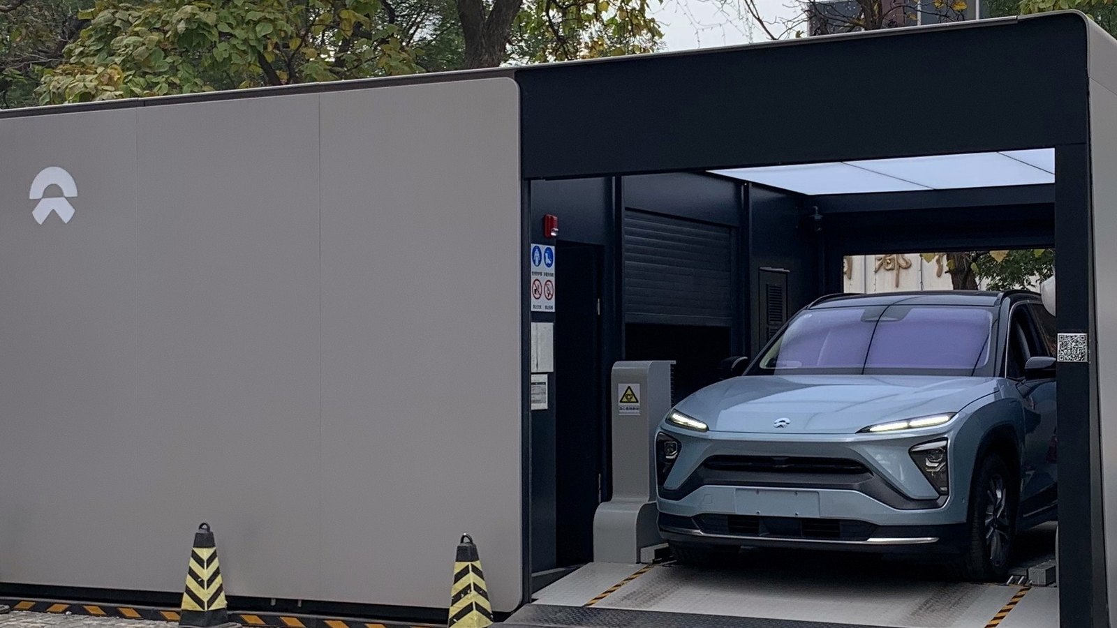 A NIO electric vehicle inside a NIO Power battery swap station in China.