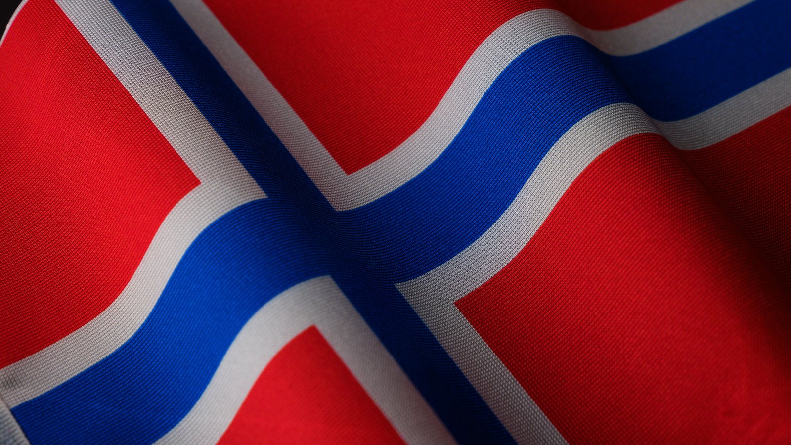 A close-up of the red, white and blue Norwegian flag.