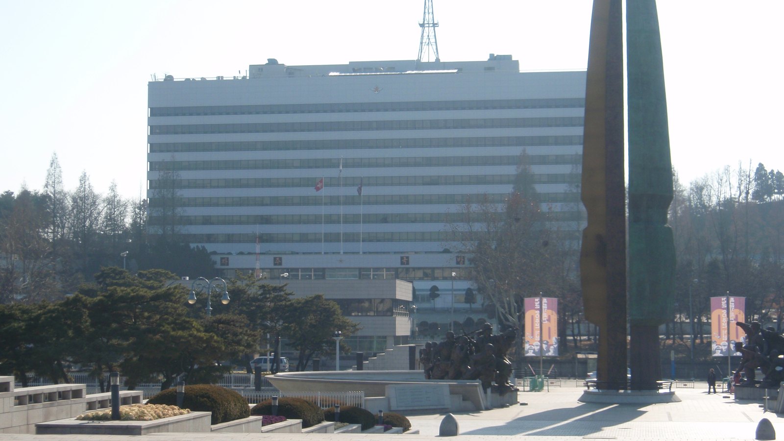 The Republic of Korea Ministry of National Defense building behind a military memorial in Seoul.