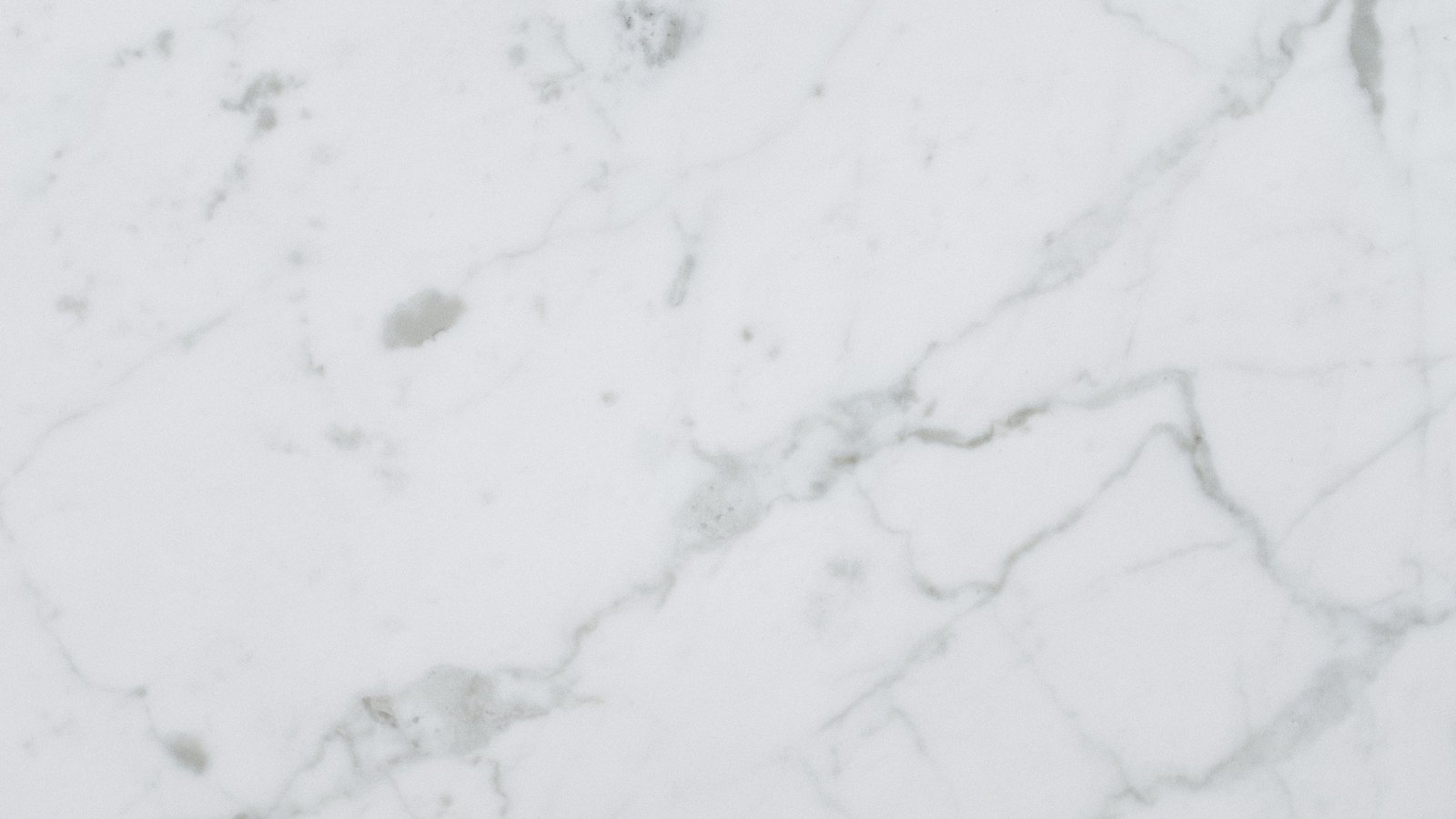 A photograph illustrating white marble slab surface macro.