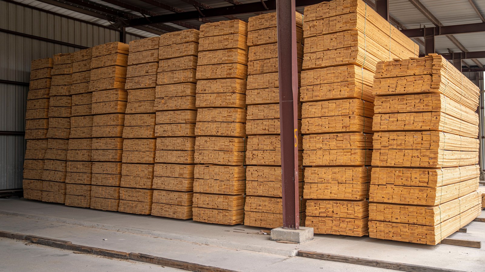 A photograph illustrating stacked framing lumber.