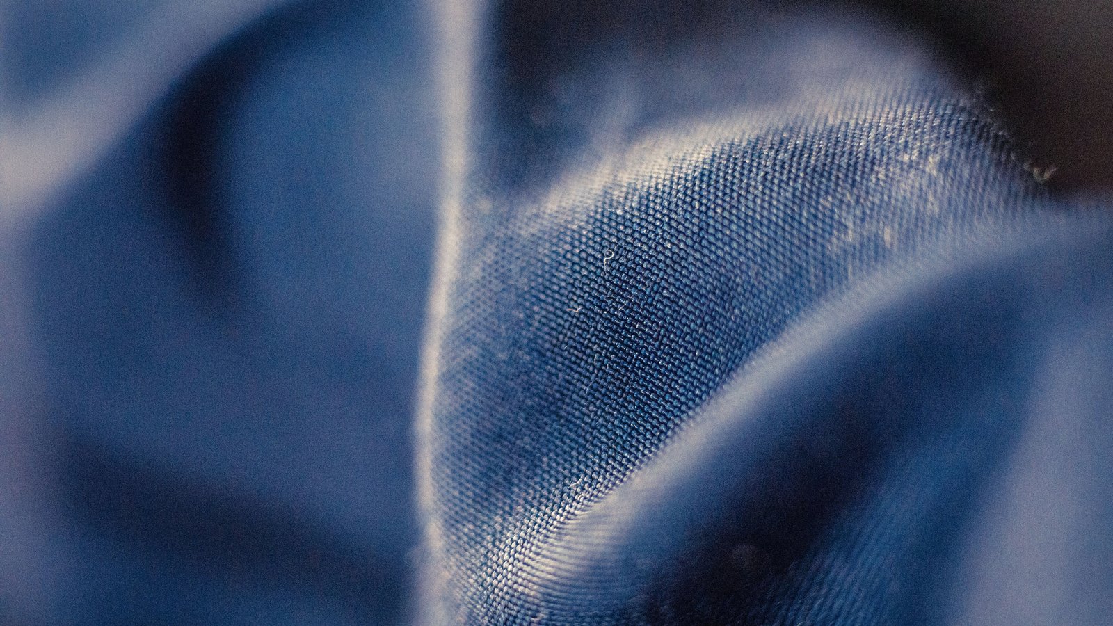 A photograph illustrating abstract blue light waves macro.