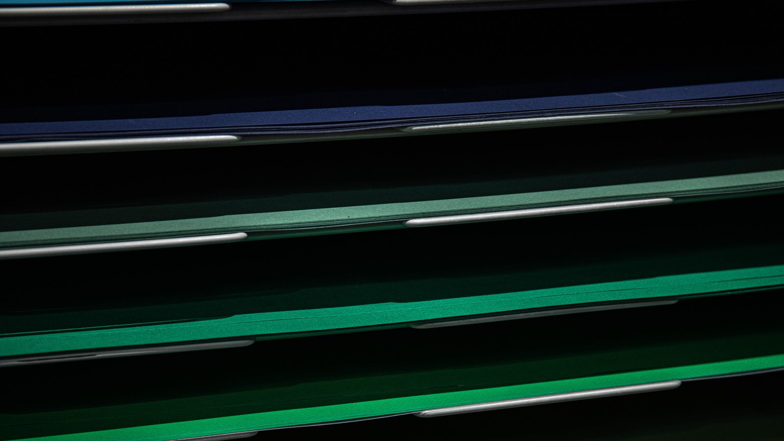 A photograph illustrating stacked paper edges.