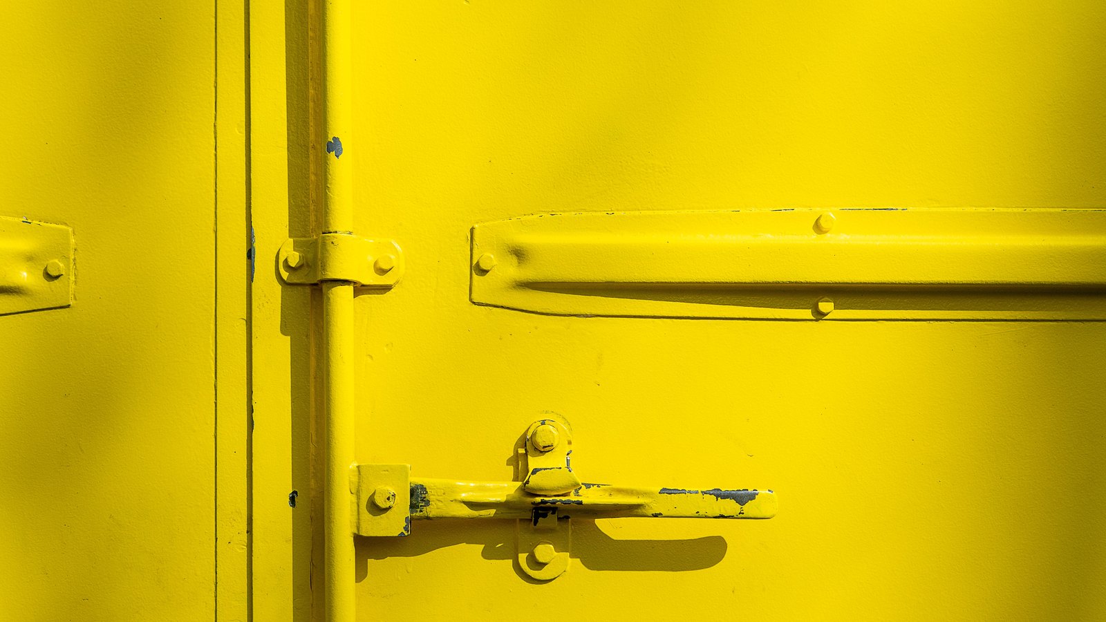 A photograph illustrating container door hinge macro.