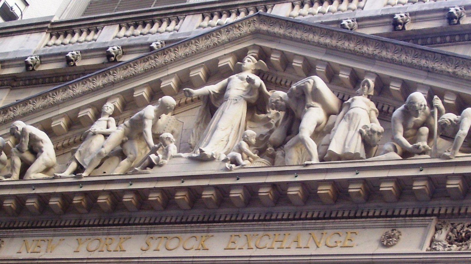 Stone figures in the pediment above the New York Stock Exchange entrance.