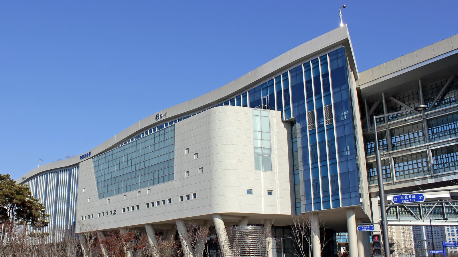 The South Korean Ministry of Land, Infrastructure and Transport building in Sejong under a clear blue sky.