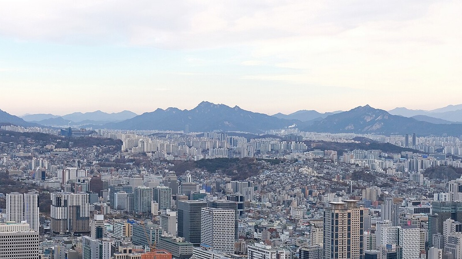 A broad view across Seoul toward mountains from Namsan, photographed in December 2022.
