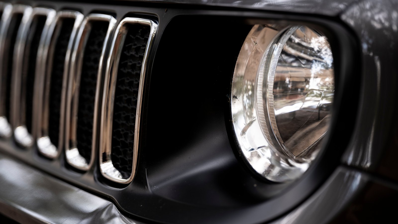 Close view of a Jeep grille and headlight, a representative image and not a photograph of this event.