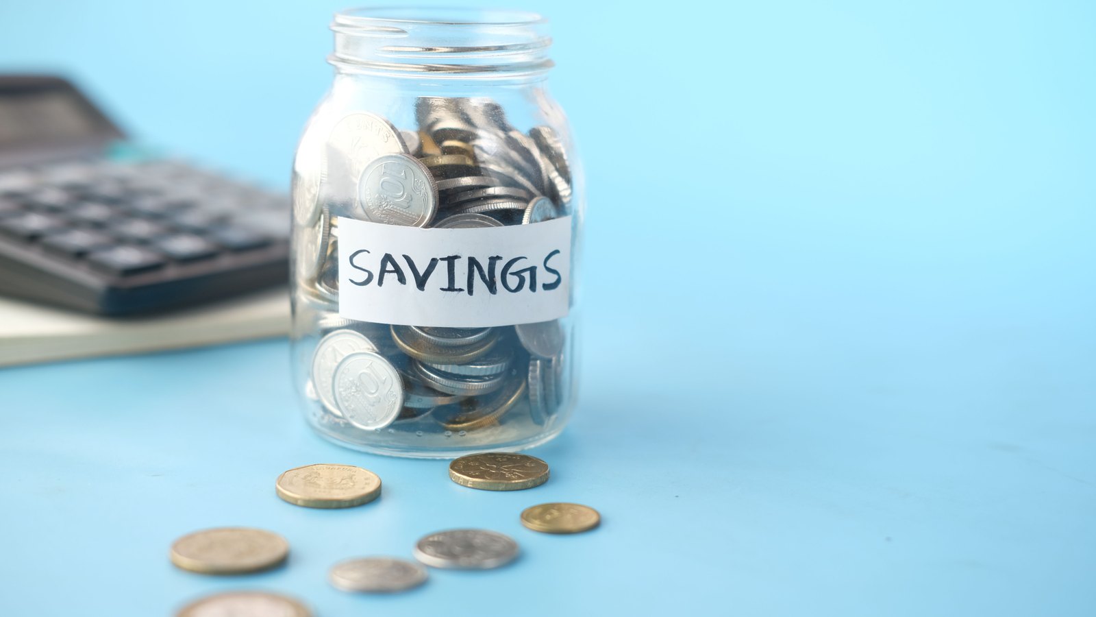 A photograph illustrating savings jar coins.