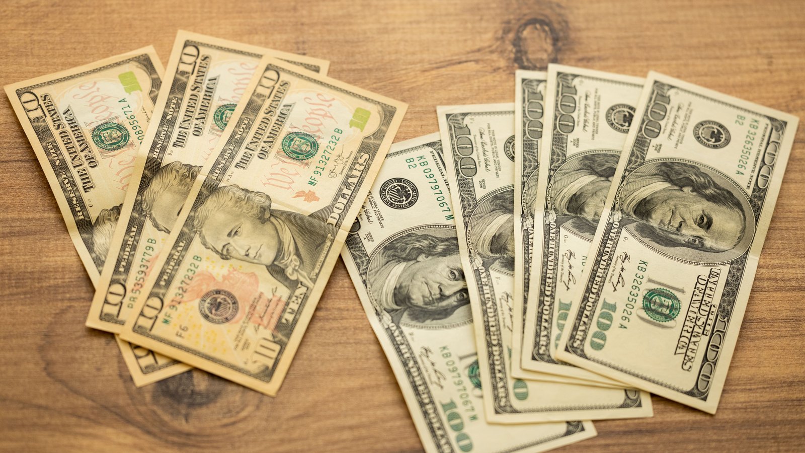 A photograph illustrating US dollar banknotes closeup.