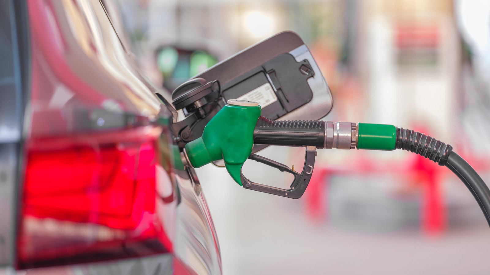 A photograph illustrating fuel pump nozzle closeup.