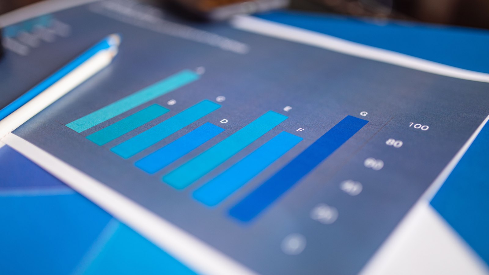 A close view of a printed blue bar chart, used as an illustration and not a photograph of this event.