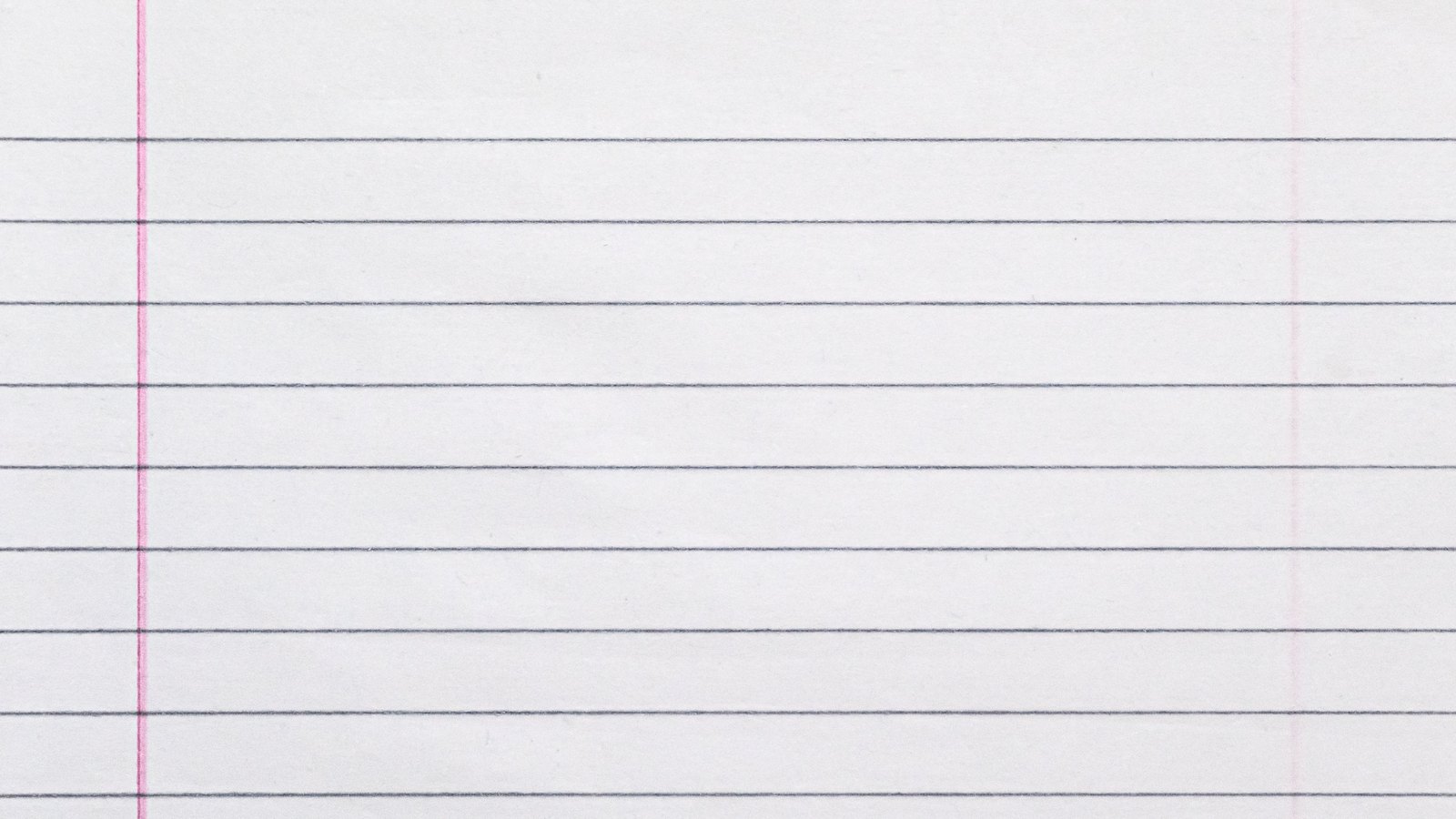 A close-up of a sheet of blank ruled notebook paper, with evenly spaced grey horizontal lines and a single pink vertical margin rule near the left edge.