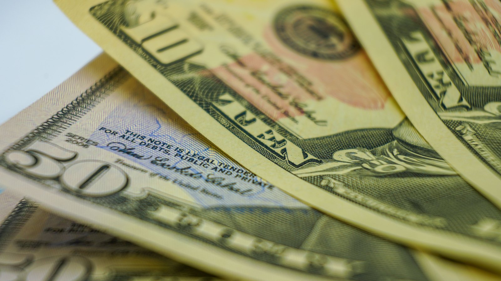 A close view of United States dollar banknotes.