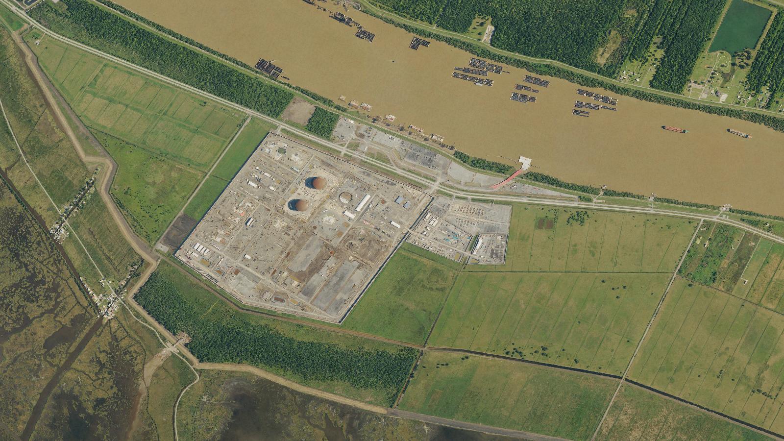 A USDA aerial image shows the Plaquemines LNG terminal construction site beside the Mississippi River in April 2023.