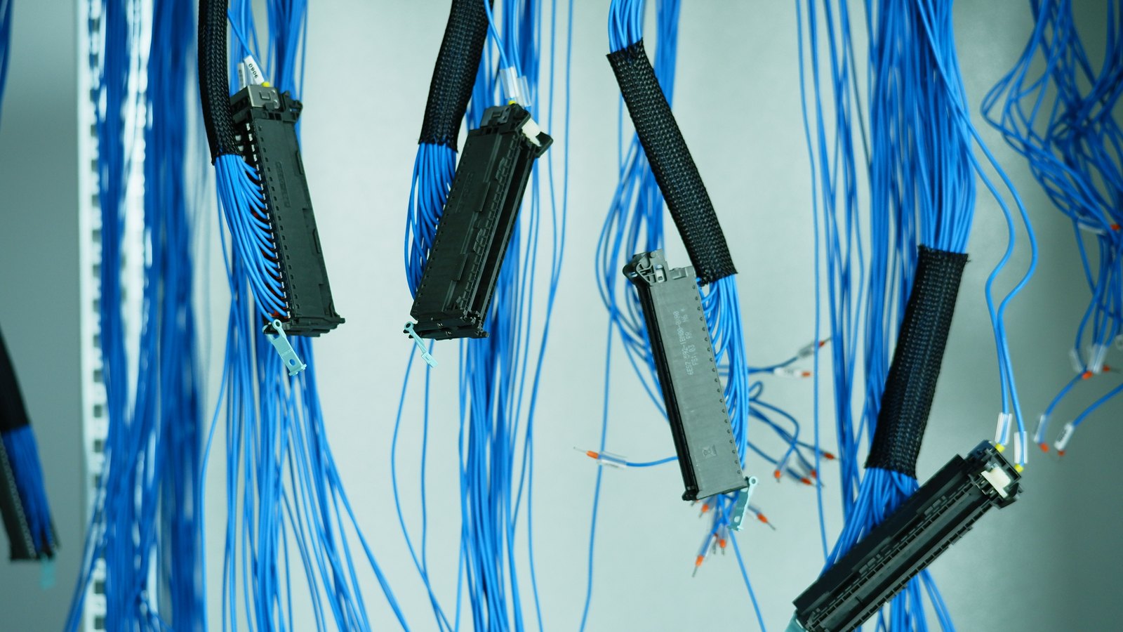 A photograph illustrating network patch panel cables.