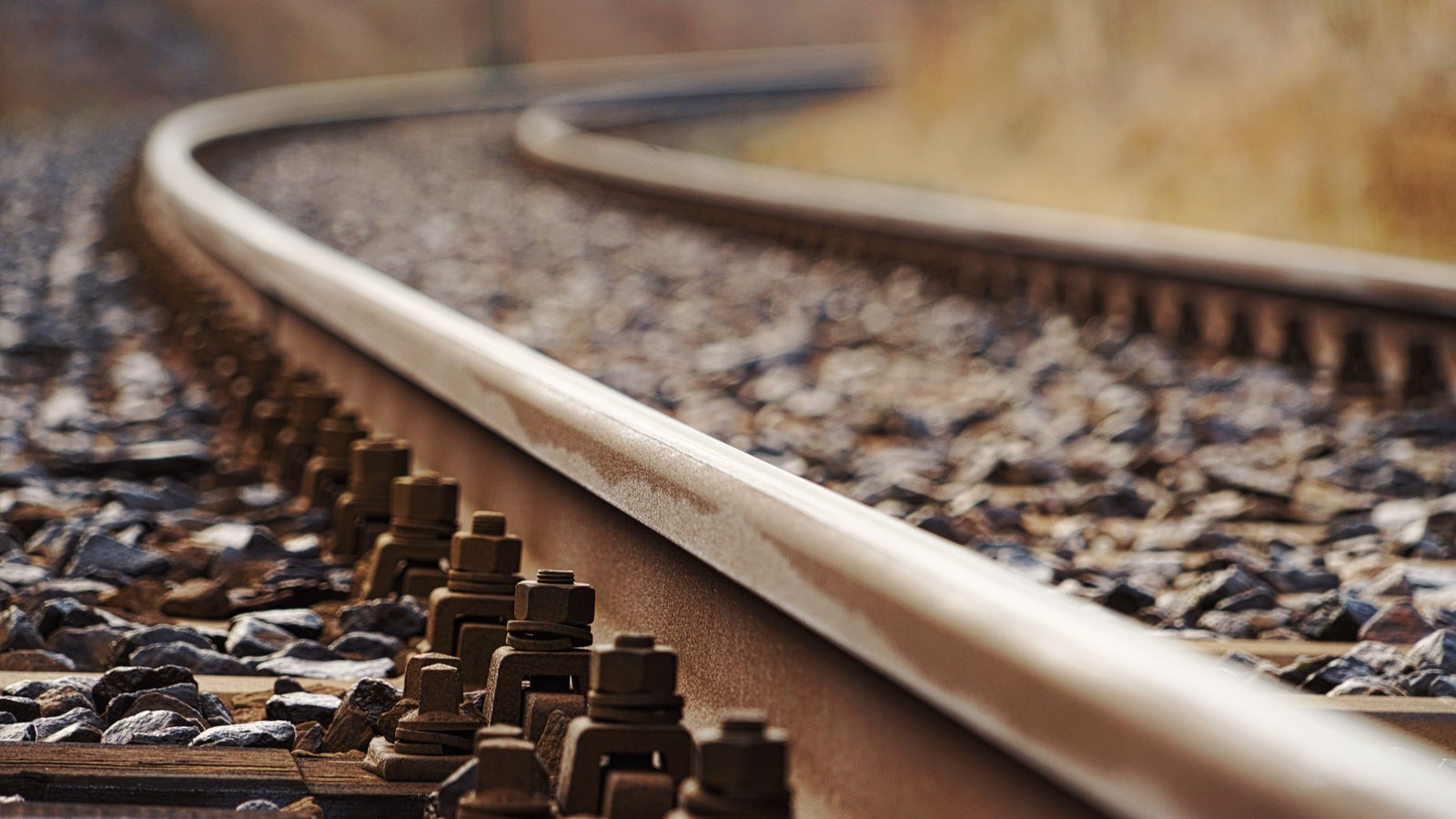A photograph illustrating steel railroad track closeup.