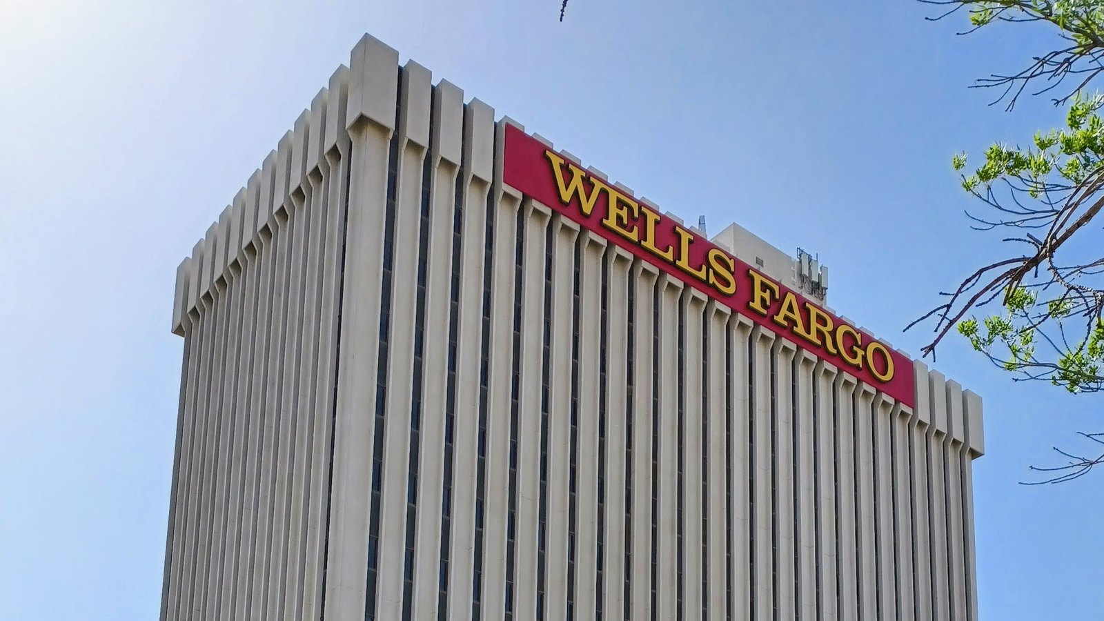 The Wells Fargo Bank Building in Albuquerque, New Mexico, with its red and yellow rooftop sign.