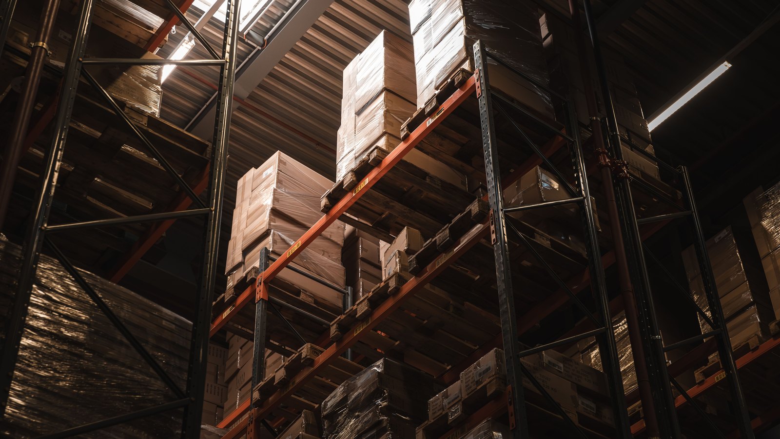 Cardboard boxes stacked on warehouse racks