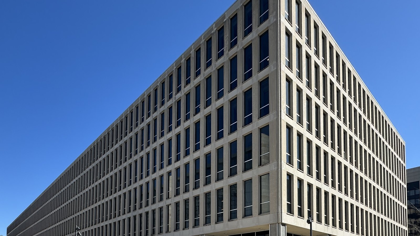The Lyndon Baines Johnson Department of Education Building in Washington, DC, photographed from the street corner under a clear sky.